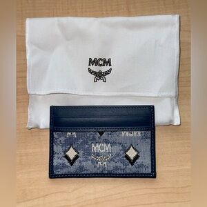 BRAND NEW: MCM Veritas Vintage Blue Denim Fabric Monogrammed Card Case Wallet